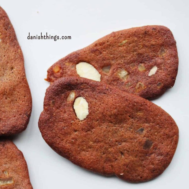 Brunkager - authentic Danish brown spiced Christmas biscuits with almonds and candied peel. A classic for the Danish Christmas coffee table - or hygge with a glass of gløgg. Find recipes, print and inspiration throughout the year at danishthings.com © Christel Parby #DanishThings #cosy #Christmas #brunkager #classic #biscuits #Christmasbiscuits #cookies #ChristmasHygge #holidays