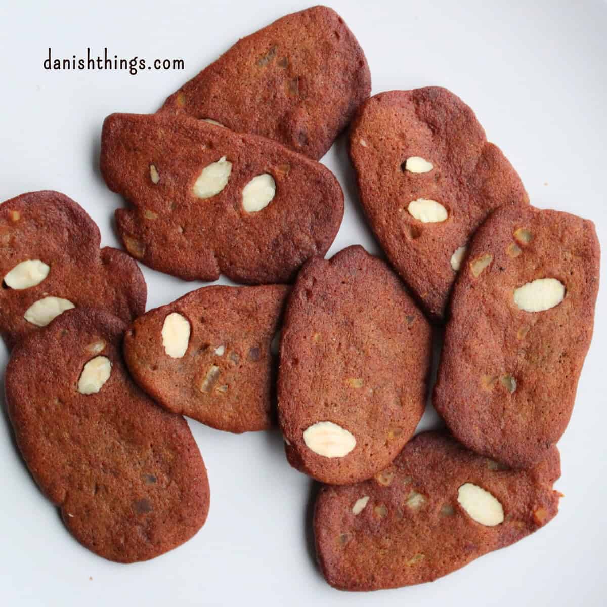 Brunkager - traditional spiced biscuits, the authentic taste of Danish Christmas Brunkager - authentic Danish brown spiced Christmas biscuits with almonds and candied peel. A classic for the Danish Christmas coffee table - or hygge with a glass of gløgg. Find recipes, print and inspiration throughout the year at danishthings.com © Christel Parby #DanishThings #cosy #Christmas #brunkager #classic #biscuits #Christmasbiscuits #cookies #ChristmasHygge #holidays